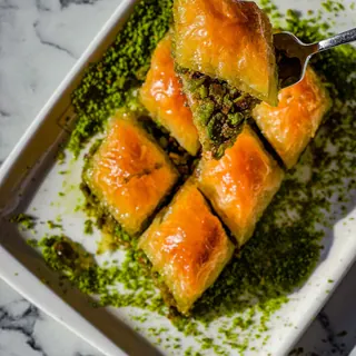 Pistachio baklava diamonds on a white tray